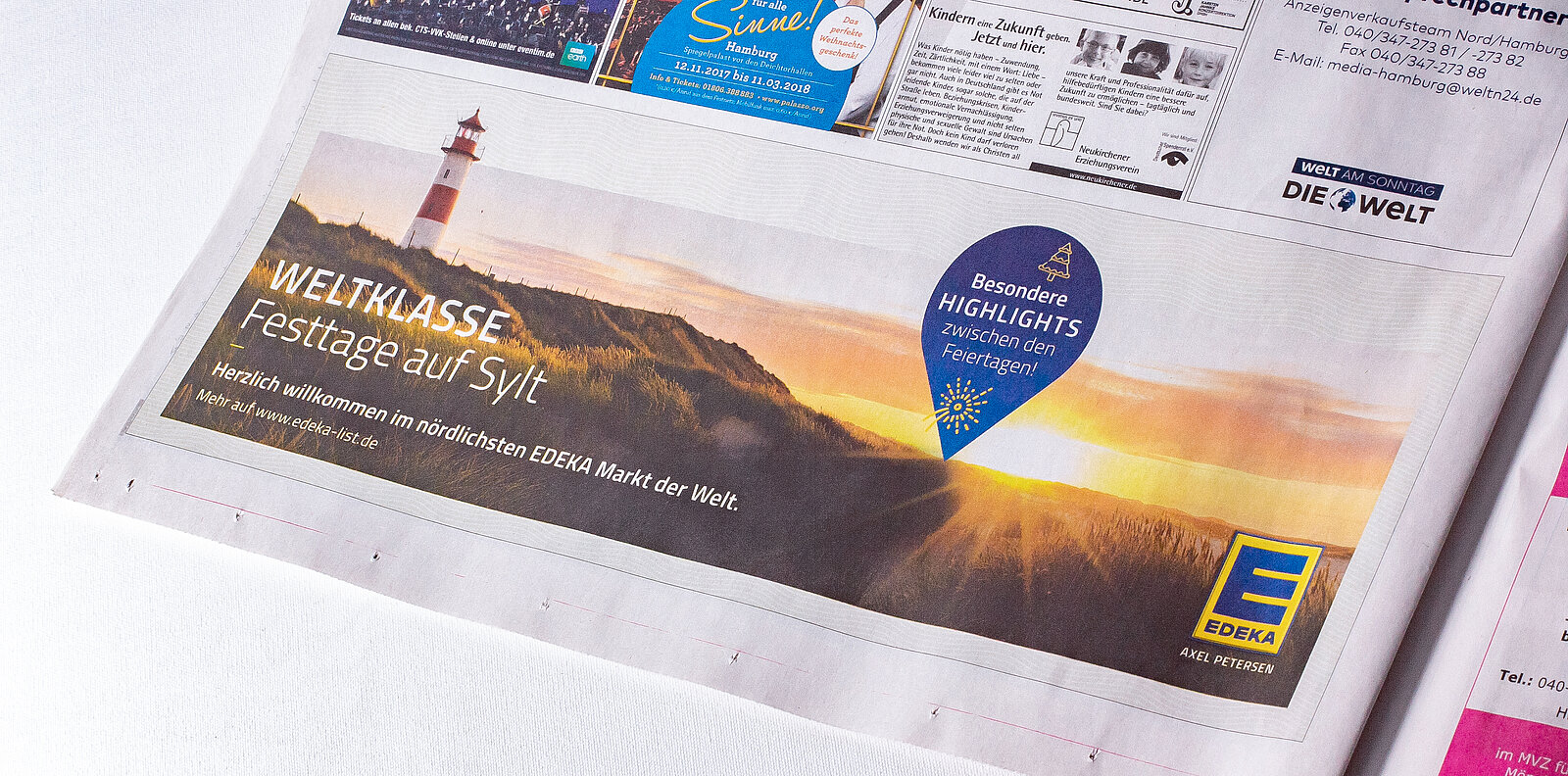 Schönes gestaltete 1/8 Anzeige in der Tageszeitung Welt am Sonntag mit Sylter Dünnen und Leuchtturm von List.